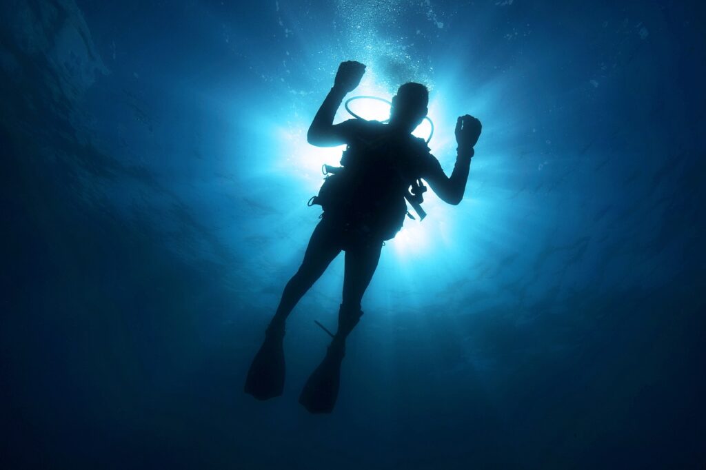 scuba diver looking down