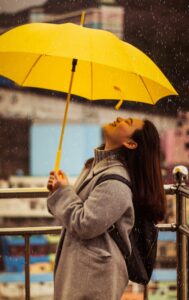 girl holding umbrella in the rain