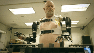 man lifting objects with prosthetic arm